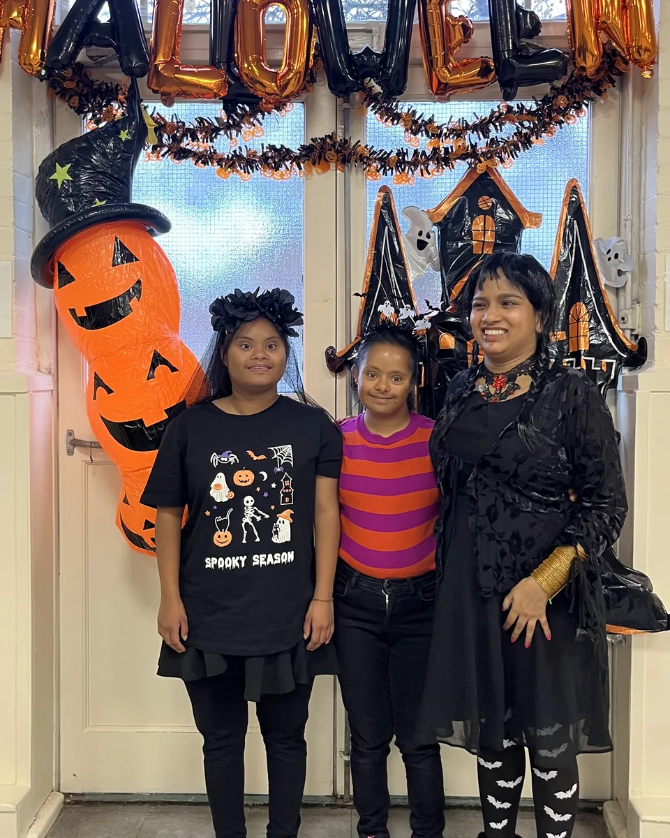 Three members of the TSC community in costume at the TSC Halloween party.